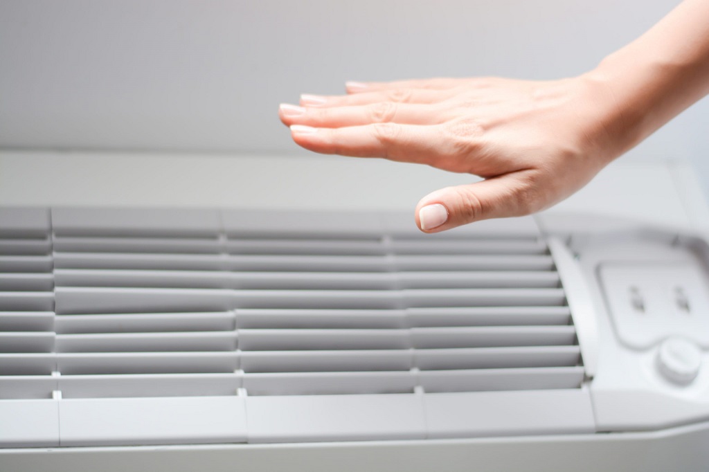 How do I turn my AC back on after a power outage?