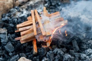 What is the best way to stack wood in a fire pit?