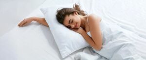 Person using a supportive queen pillow matched to their sleeping position.